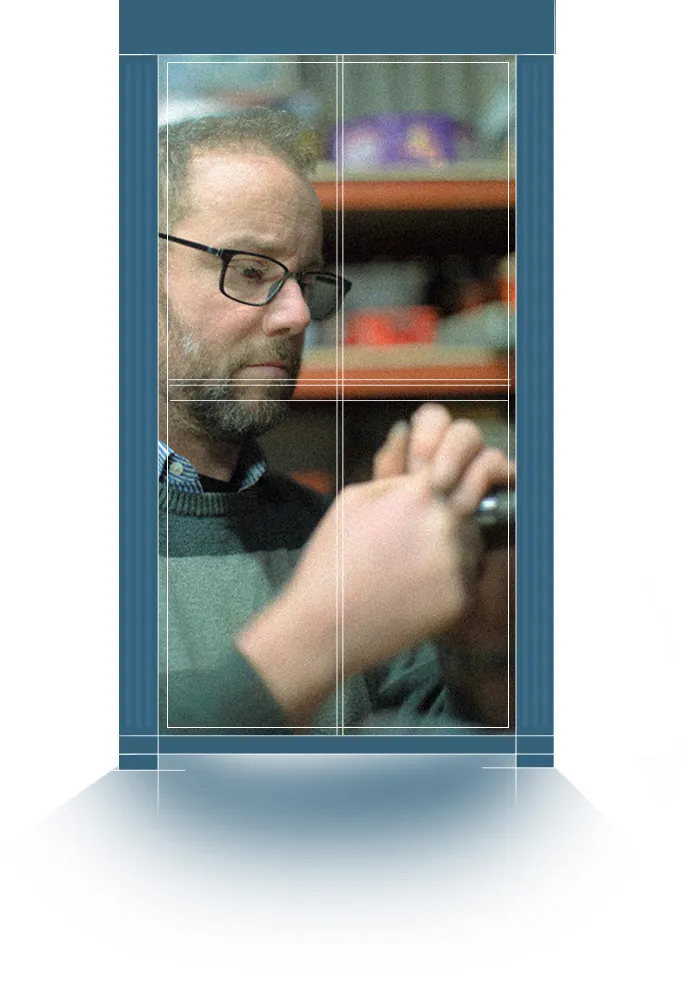 Photo of man working in a window frame